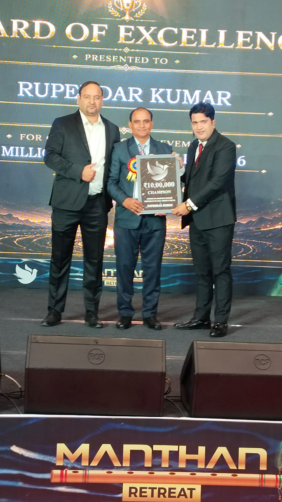 Award of Excellence presented to Rupesh Kumar for outstanding achievement — Multi Millionaire Championship, Manthan Retreat.